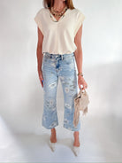 Cap sleeve top with structured collared silhouette