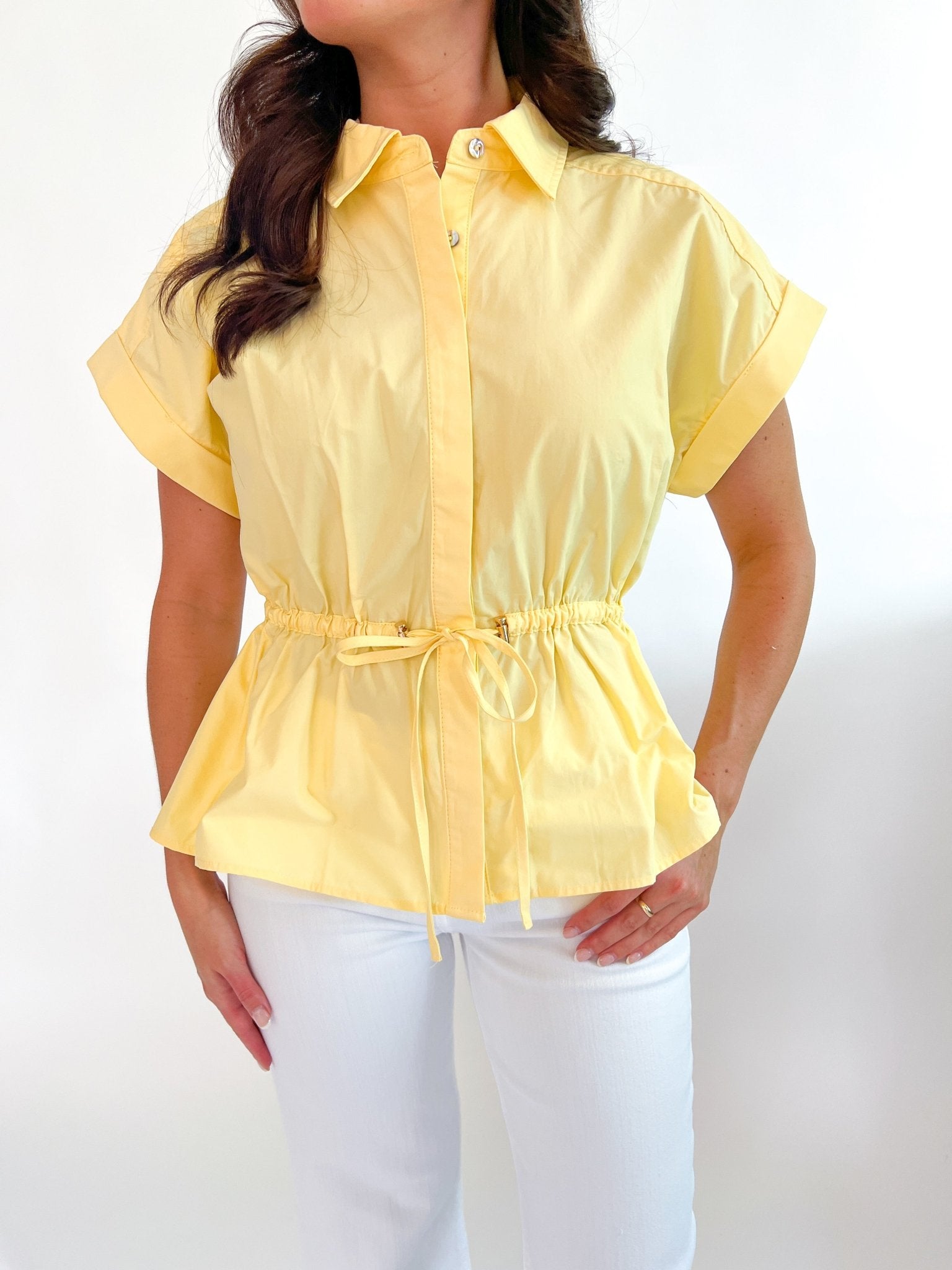 Lemon yellow cap sleeve top with structured polished silhouette