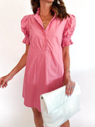 Pink poplin mini dress with ruffle neckline