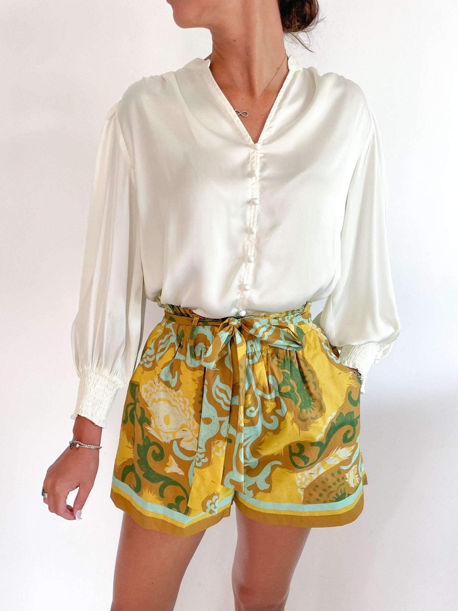 Off-white button blouse with split neckline