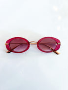 Red thin oval frame sunglasses with metal construction