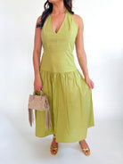 Green halter maxi dress with deep V-neckline