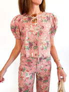 Pink floral top with short puff sleeves