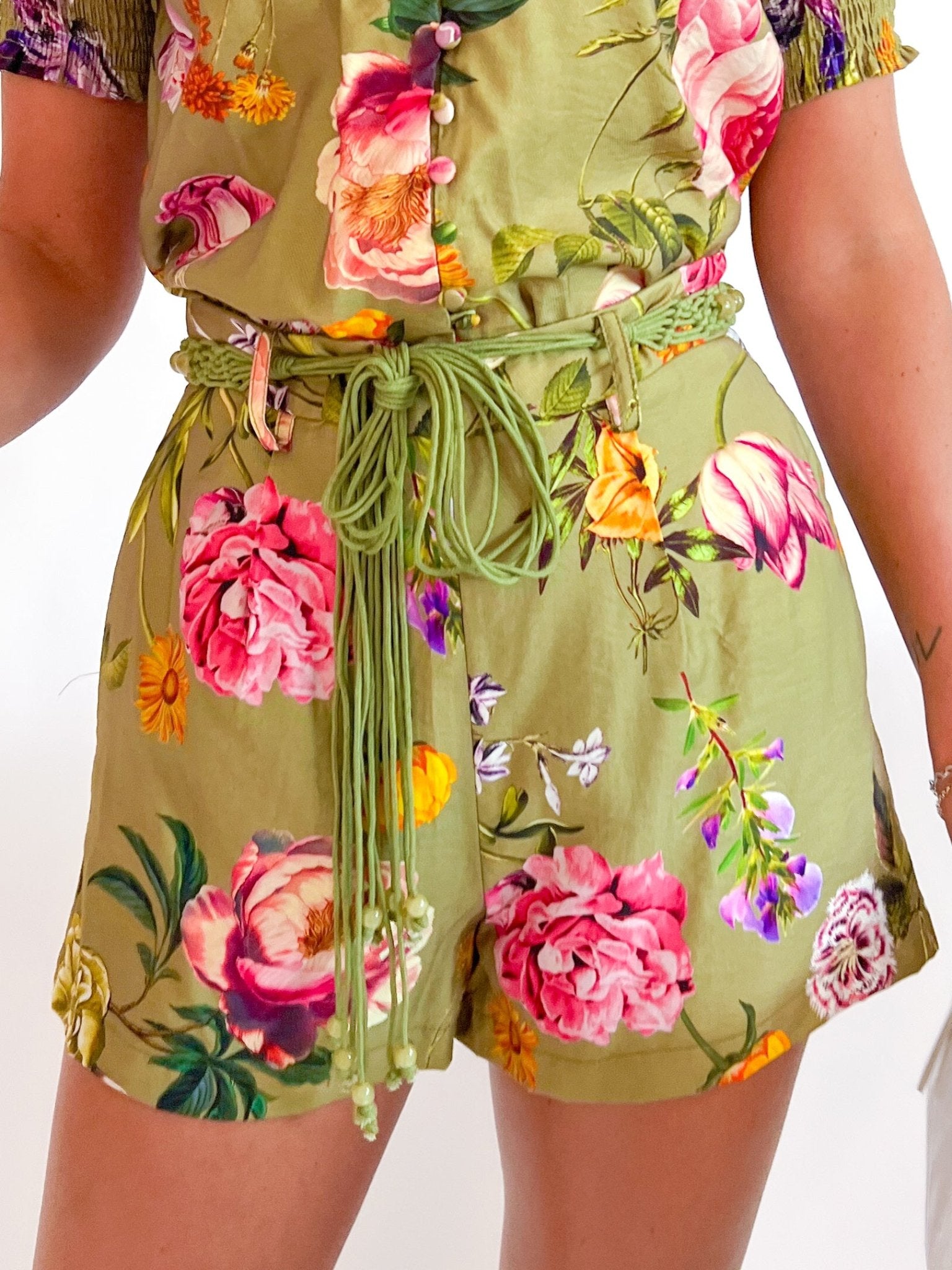 Floral pleated shorts with braided tie belt